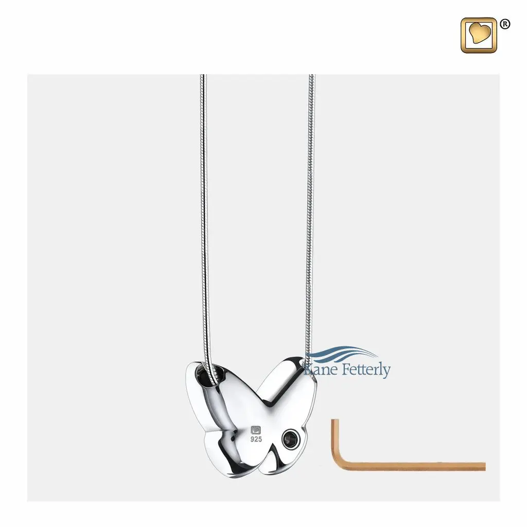 Features a small compartment designed to hold a token of cremated remains.