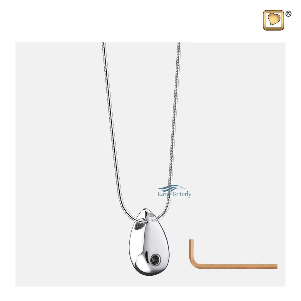 The pendant features a small compartment to hold a token of ashes.