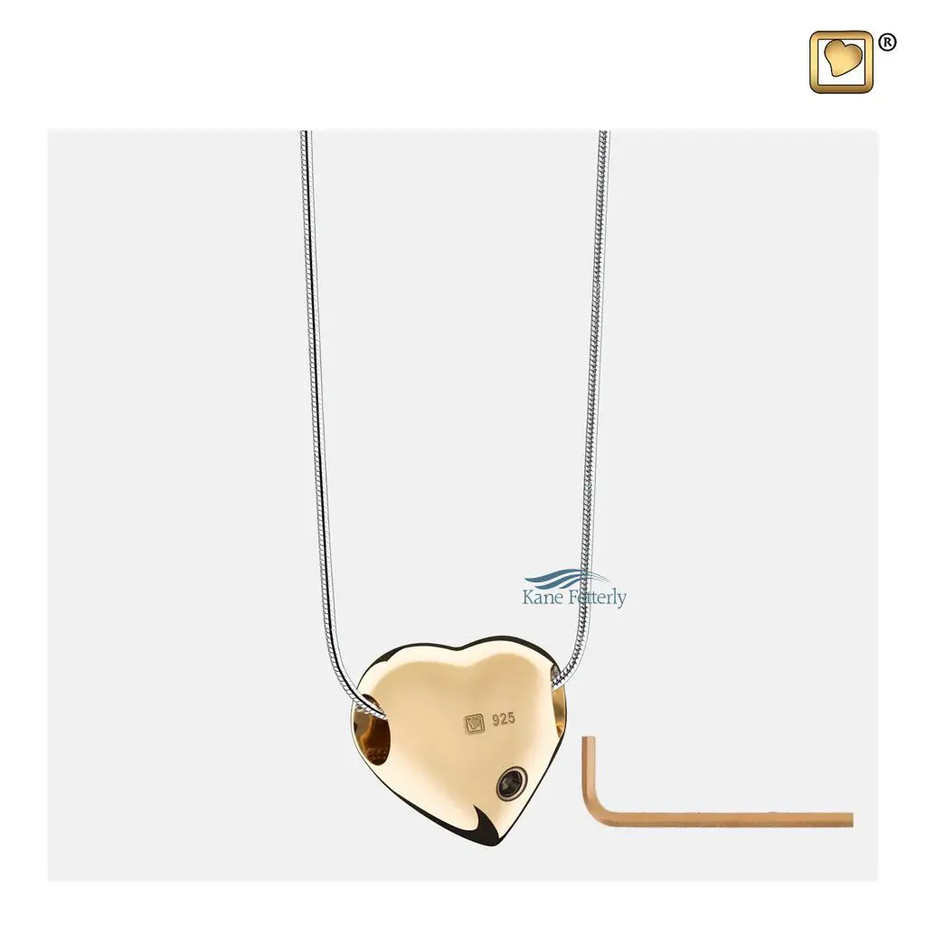 The pendant features a small compartment to hold a token of ashes.