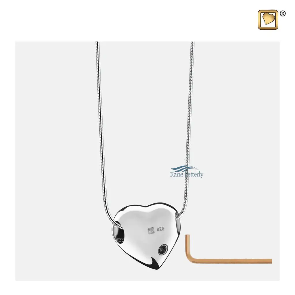 The pendant features a small compartment to hold a token of ashes.