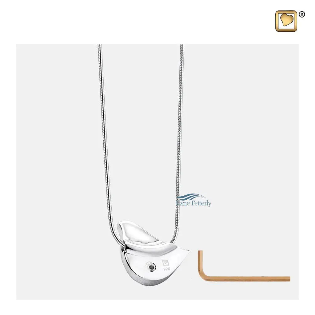 Features a small compartment designed to hold a token of cremated remains.