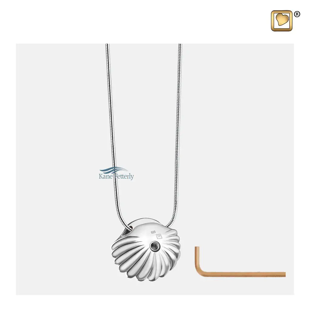 The pendant features a discreet back compartment for holding ashes.