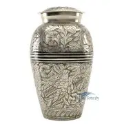 Brass urn with silver polished finish and engraved floral motifs.