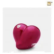 Urne miniature en forme de coeur ornée de cristal avec finition rouge perlée.