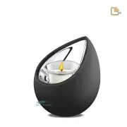 Mini urne en acier inoxydable et alliage en forme de bougeoir avec une finition bicolore en noir mat et en argent poli.