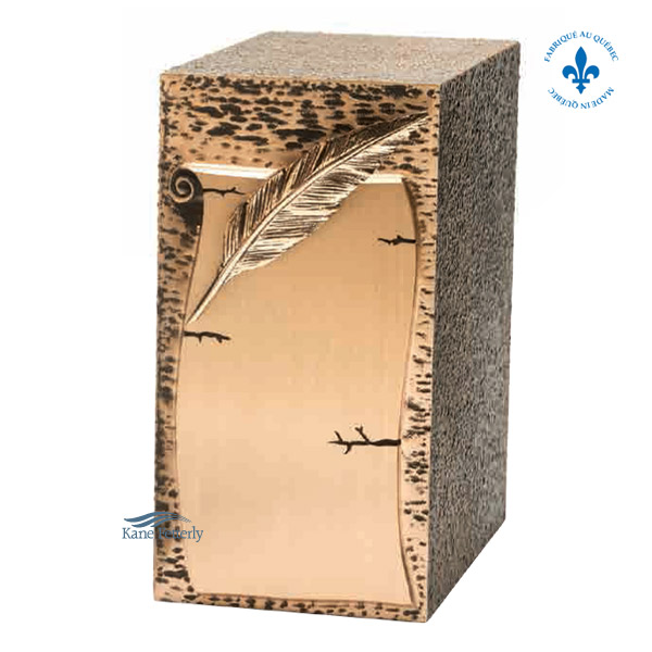Zinc and bronze urn with feather quill on parchement paper