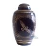 Blue and gold brass urn with dove