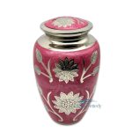 Pink brass urn with silver sunflowers and foliage
