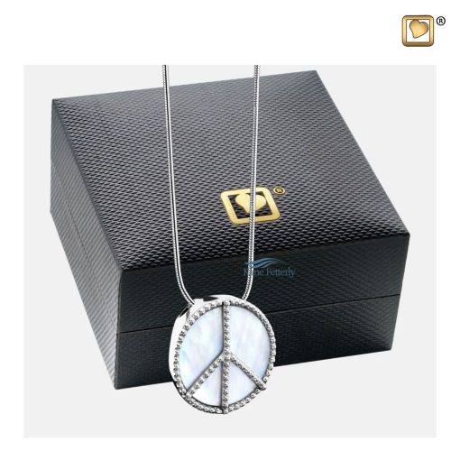 Pendant for ashes with peace symbol shown with jewelry box