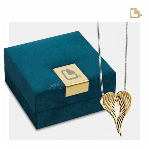 Pendentif cinéraire en forme d'ailes d'ange, présenté avec un coffret à bijoux.