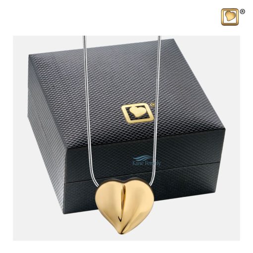 Heart pendant for ashes shown with jewelry box