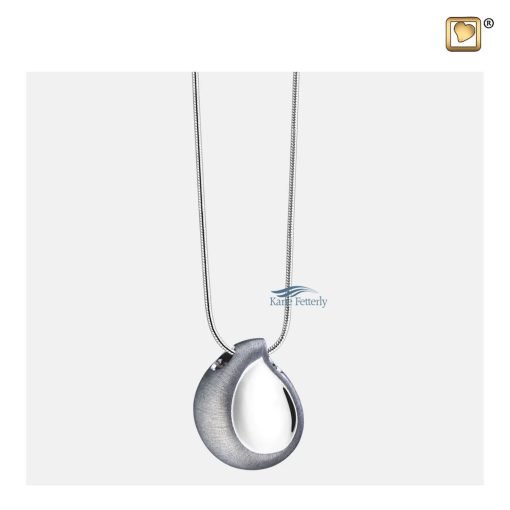 A sterling silver chain is included in the price.