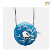 Round pendant for ashes with silver bird on blue enamel
