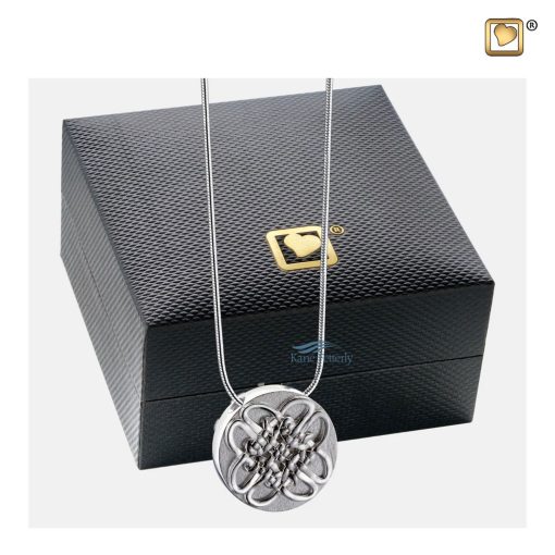 Pendentif cinéraire en forme de cercle celtique illustré avec coffret à bijoux