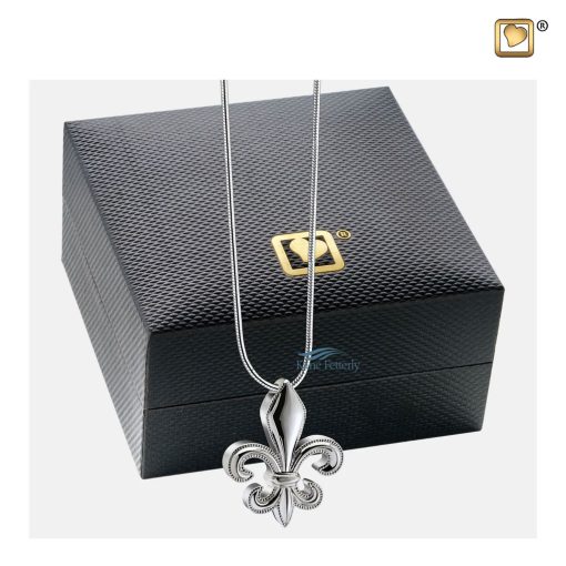 Fleur de lys pendant for ashes shown with jewelry box