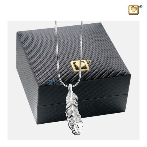 Feather-design pendant for ashes shown with jewelry box