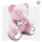 Urne pour enfant en forme de ourson avec cristal et une finition rose nacrée et des accents en argent poli.