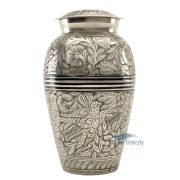 Brass urn with silver polished finish and engraved floral motifs.