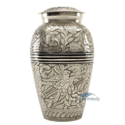 Brass urn with silver polished finish and engraved floral motifs.