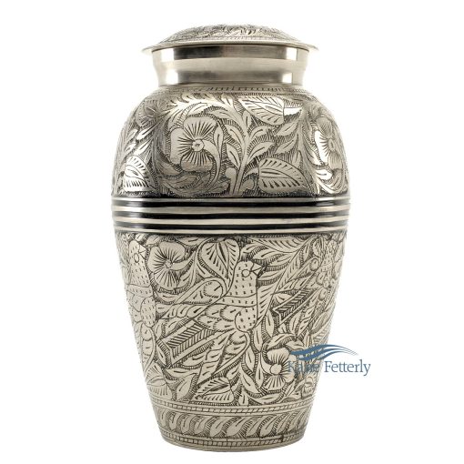Brass urn with silver polished finish and engraved floral motifs.