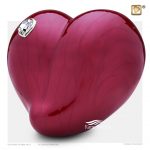 Urne rouge en forme de coeur ornée de cristal avec finition rouge perlée.