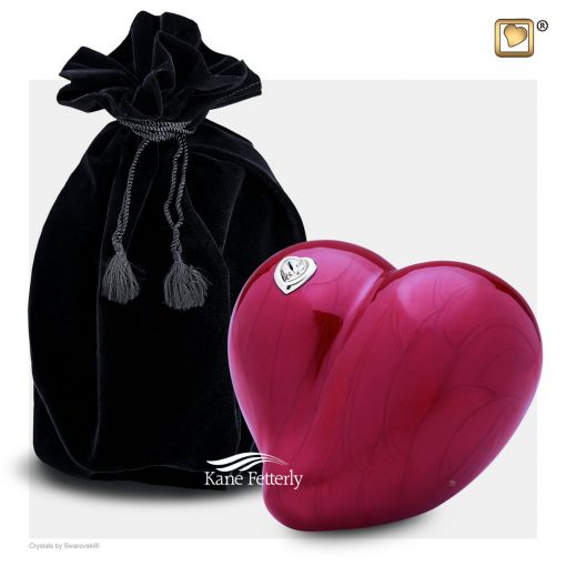 Red heart urn for infant shown with velvet bag