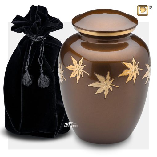 Brown metal urn with gold leaves shown with velvet bag