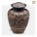 Black and gold brass urn with floral motifs and butterfly wings
