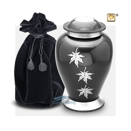 Metal urn with silver leaves shown with velvet bag