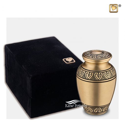 Miniature urn shown with velvet box