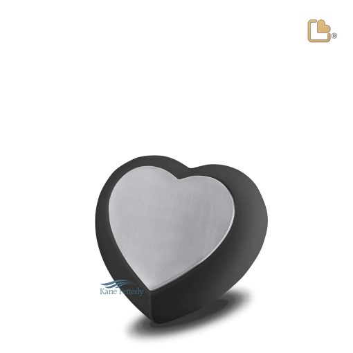 Urne miniature en forme de larme avec une finition bicolore en noir mat et en étain brossé.