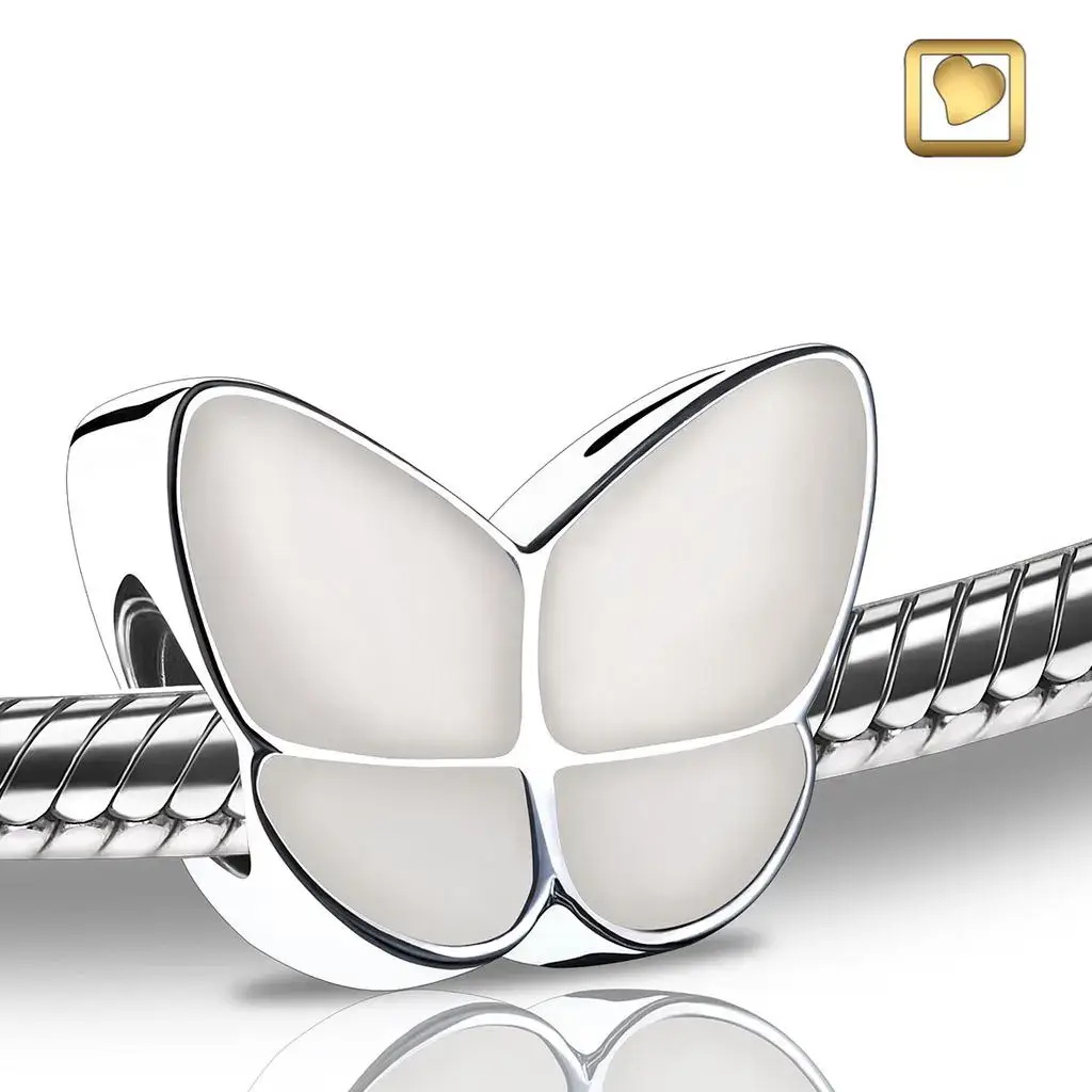 Silver butterfly cremation jewelry bead with white enamel wings available at Kane Fetterly Funeral Home in Montreal
